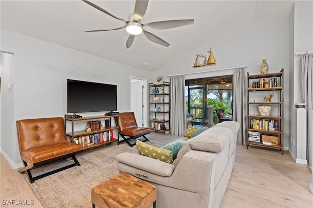 living room with ceiling fan, light hardwood / wood-style floors, and lofted ceiling