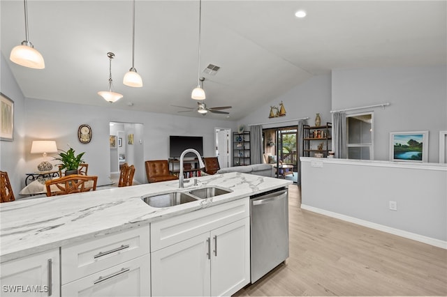 kitchen featuring white cabinetry, dishwasher, sink, light hardwood / wood-style floors, and lofted ceiling