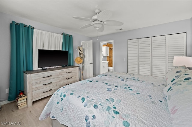 bedroom with ceiling fan, a closet, ensuite bathroom, and light wood-type flooring