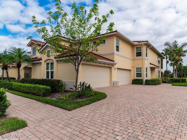 mediterranean / spanish-style house featuring a garage