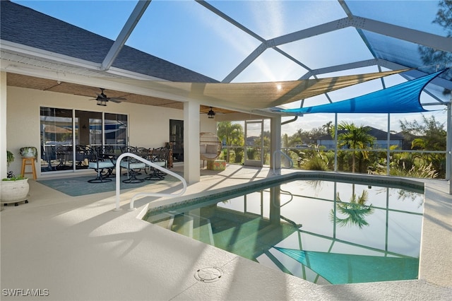 view of pool featuring a patio area and glass enclosure