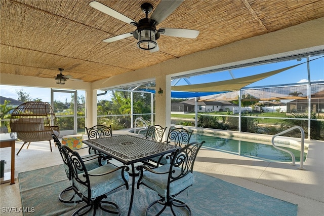 211 SW 21st Ln, Cape Coral, FL 33991 - view of patio with ceiling fan, glass enclosure, and an outdoor pool