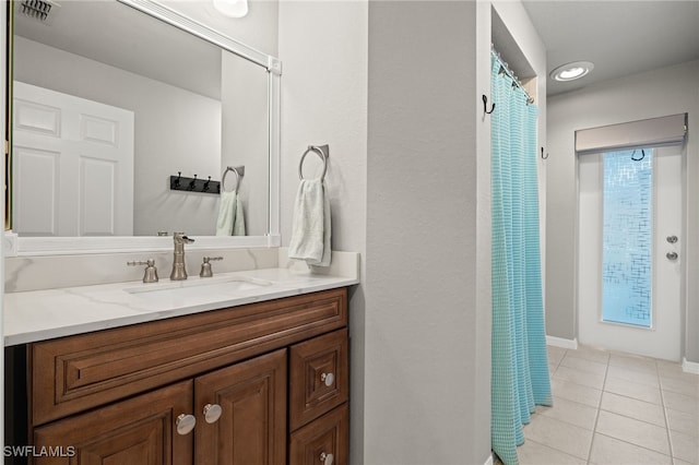 211 SW 21st Ln, Cape Coral, FL 33991 - bathroom with tile patterned flooring, vanity, and curtained shower