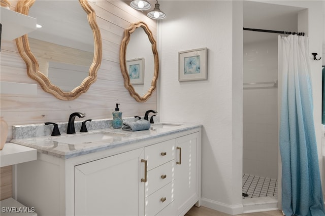 bathroom with a shower with curtain and vanity