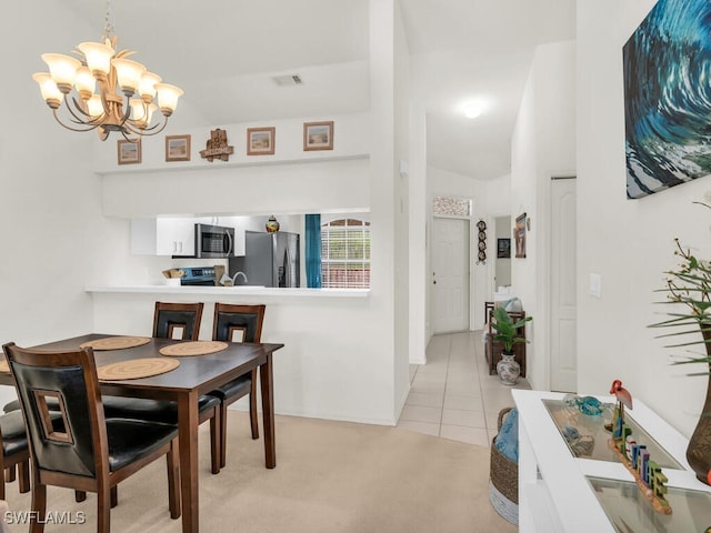 carpeted dining space featuring a notable chandelier and lofted ceiling