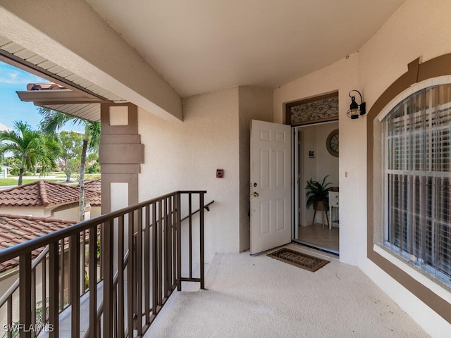 entrance to property with a balcony