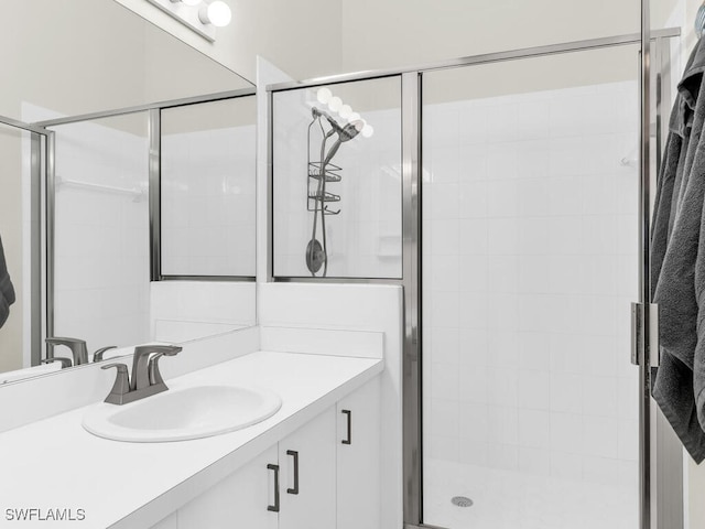 bathroom with vanity and an enclosed shower