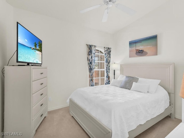 carpeted bedroom featuring multiple windows and ceiling fan