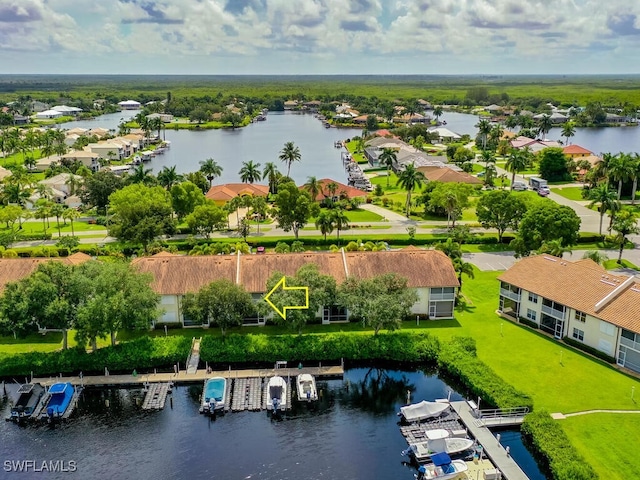 birds eye view of property with a water view