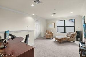 carpeted office featuring visible vents, crown molding, and recessed lighting