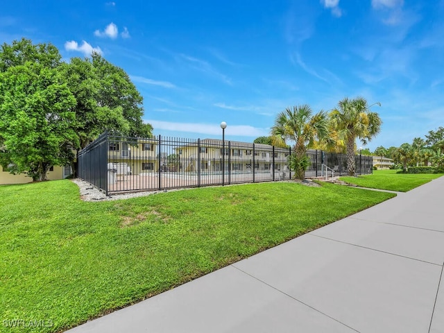 view of property's community featuring a yard