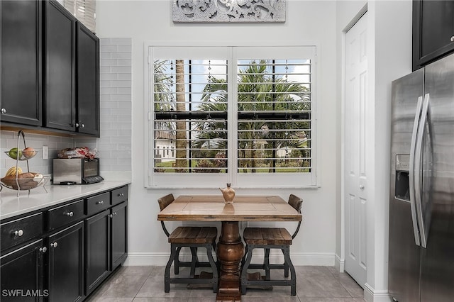 tiled dining area featuring breakfast area