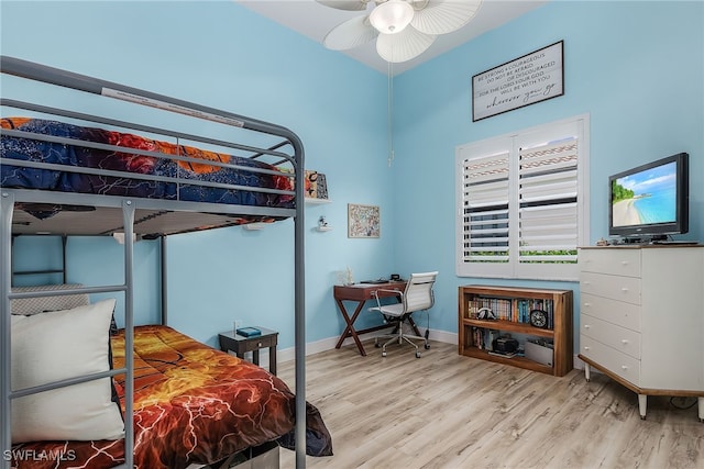 bedroom with ceiling fan and light hardwood / wood-style flooring