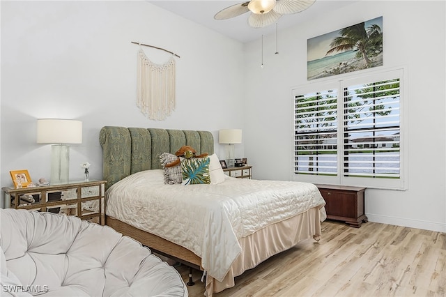 bedroom with ceiling fan and light hardwood / wood-style flooring