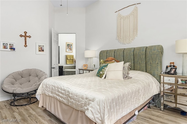 bedroom with light hardwood / wood-style floors