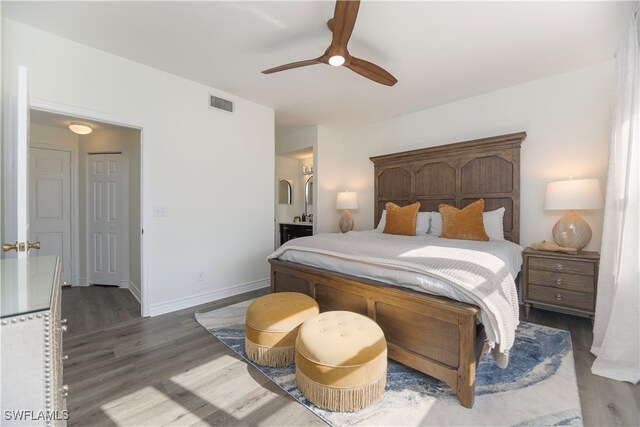 bedroom featuring dark hardwood / wood-style floors and ceiling fan