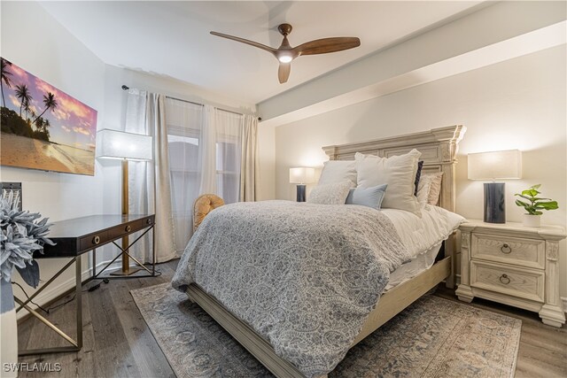 bedroom featuring dark hardwood / wood-style flooring and ceiling fan