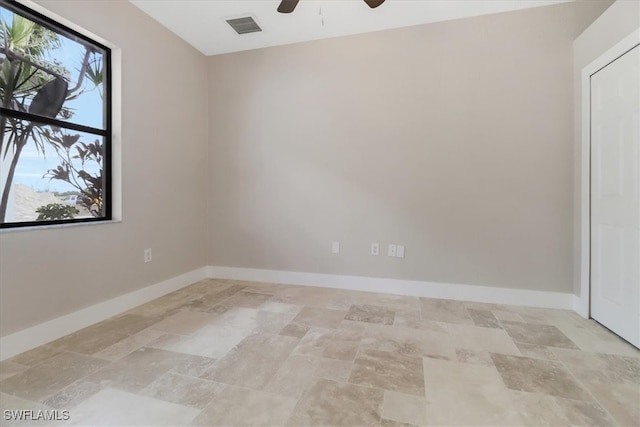 empty room featuring ceiling fan