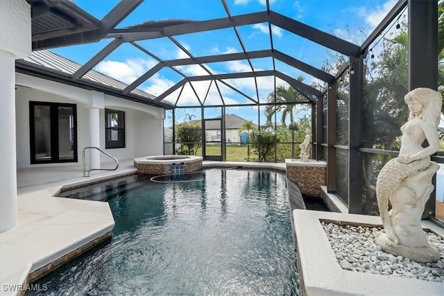 view of pool with a lanai, an in ground hot tub, and a patio