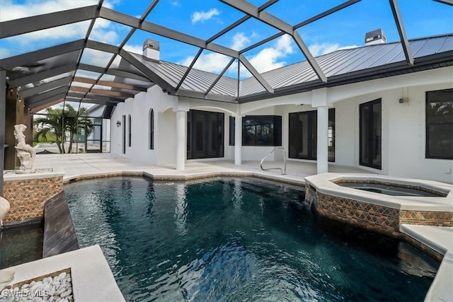 view of swimming pool with a patio area, an in ground hot tub, and glass enclosure