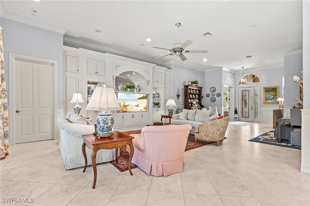 tiled living room featuring ceiling fan and ornamental molding