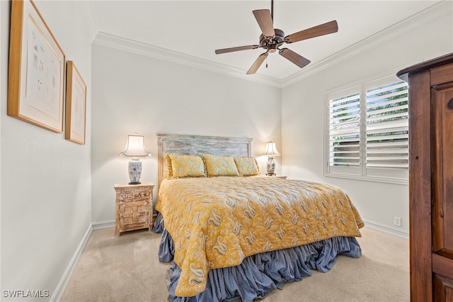 bedroom featuring ornamental molding, light colored carpet, and ceiling fan