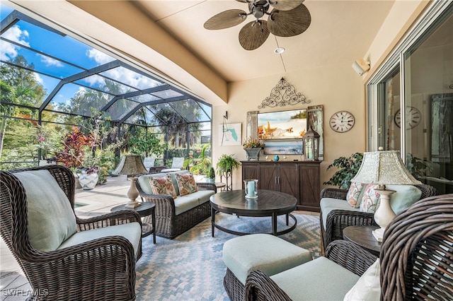 sunroom with lofted ceiling and ceiling fan