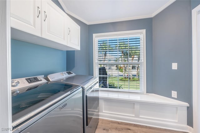 laundry room featuring independent washer and dryer, wood finished floors, cabinet space, and crown molding