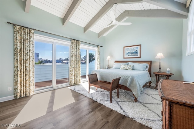 bedroom with access to exterior, wood-type flooring, beam ceiling, a water view, and high vaulted ceiling