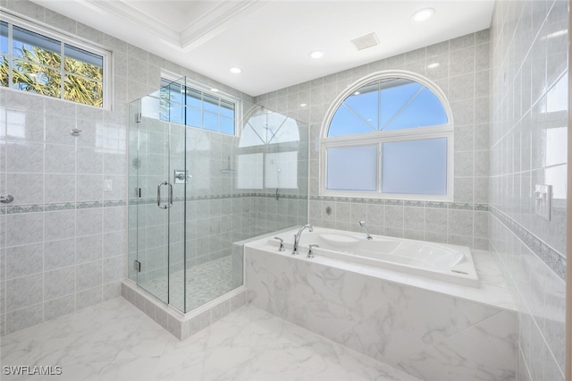 bathroom featuring shower with separate bathtub, tile walls, and ornamental molding