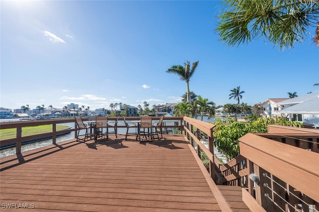 wooden deck with a water view