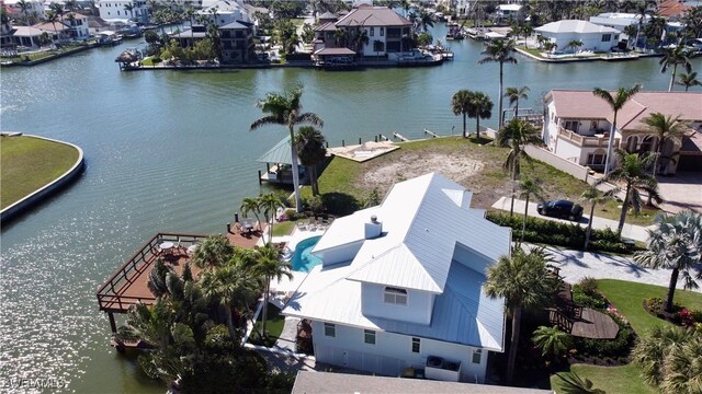 bird's eye view with a water view and a residential view