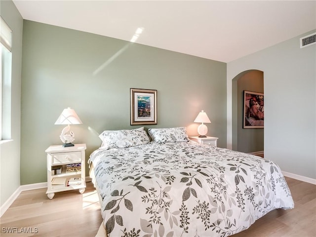 bedroom with light hardwood / wood-style floors