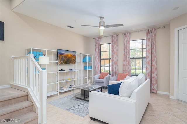 living room with ceiling fan and light tile patterned floors