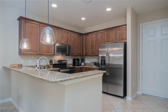 kitchen with stainless steel appliances, light stone counters, kitchen peninsula, light tile patterned floors, and hanging light fixtures