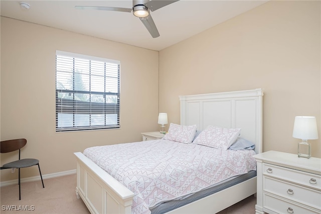 bedroom with light carpet and ceiling fan