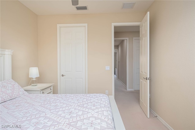 bedroom featuring light colored carpet