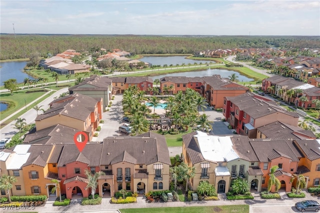 birds eye view of property with a water view