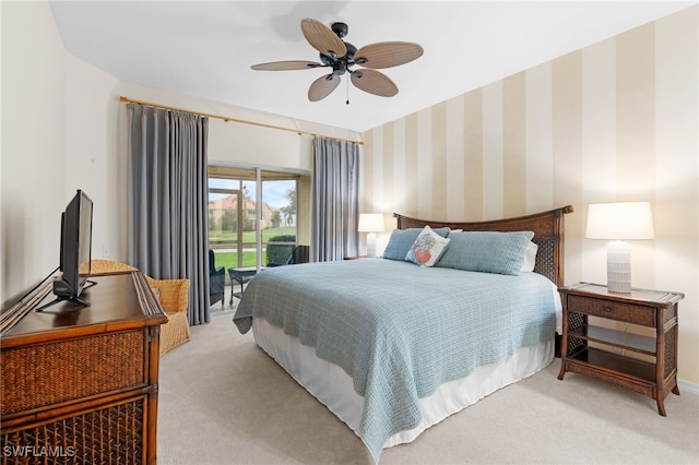 bedroom featuring light carpet, access to outside, and ceiling fan