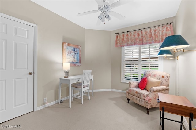 carpeted office featuring ceiling fan