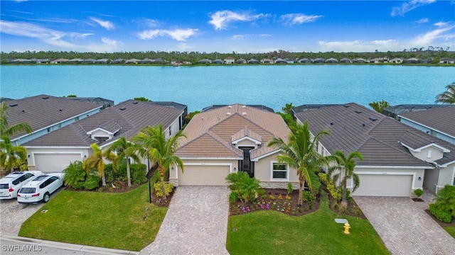 birds eye view of property with a water view