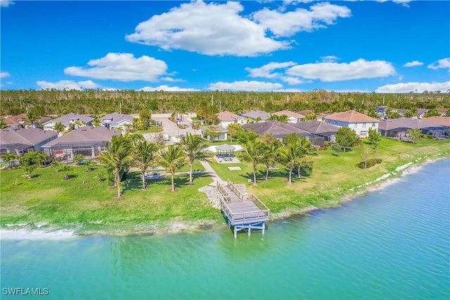 birds eye view of property featuring a water view and a residential view