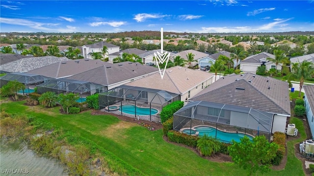 birds eye view of property with a residential view