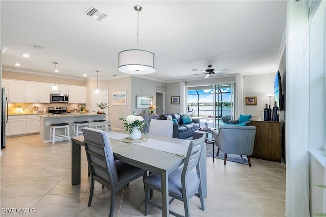 dining room featuring a ceiling fan, recessed lighting, visible vents, and crown molding