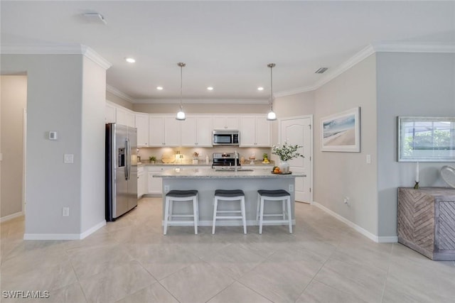 kitchen featuring white cabinetry, appliances with stainless steel finishes, a sink, and ornamental molding