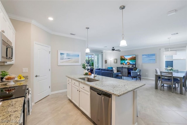 kitchen with stainless steel appliances, a sink, visible vents, white cabinetry, and ornamental molding