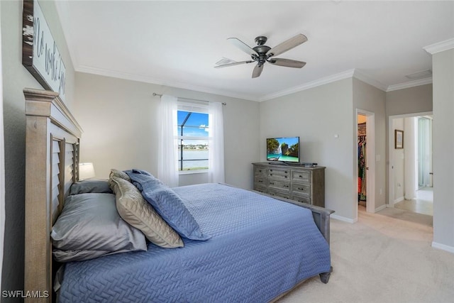 bedroom featuring light carpet, baseboards, ceiling fan, ornamental molding, and a spacious closet