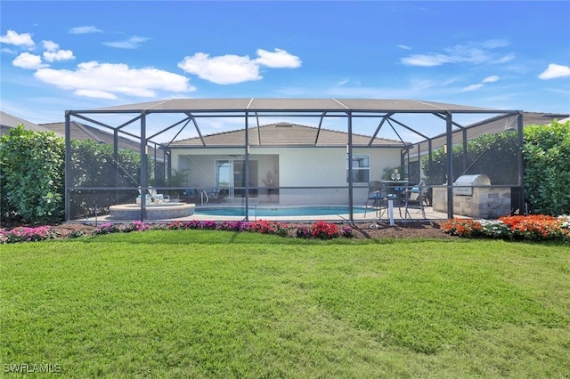 rear view of property with an outdoor pool, a lanai, a lawn, and an outdoor kitchen