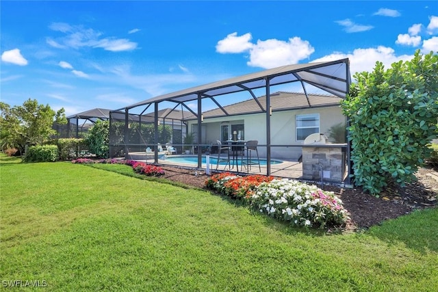 outdoor pool with glass enclosure and a lawn