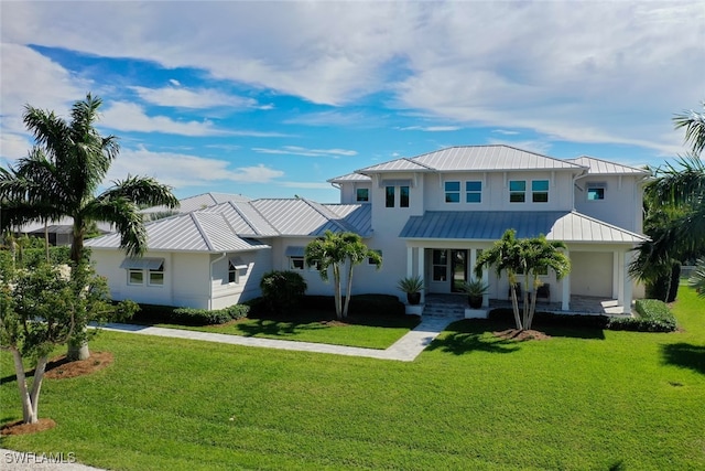 view of front of home featuring covered porch and a front lawn